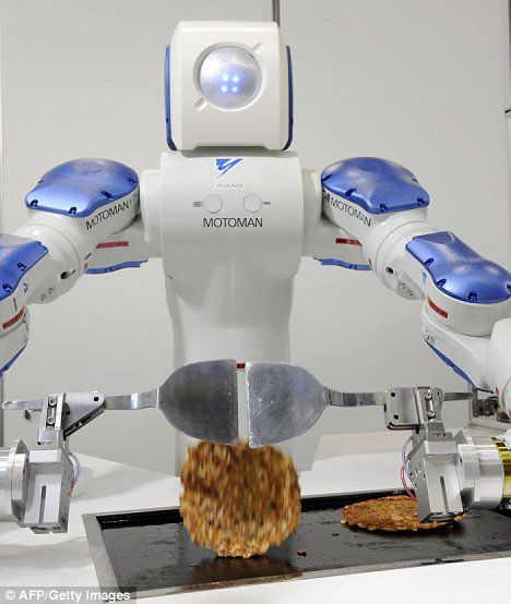 "摩托曼(motoman)"在展会上演示做煎饼